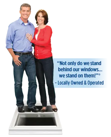Window World owners standing on a window beside the message: Not only do we stand behind our windows, we stand on them. Locally Owned and Operated.